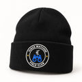 Flock Watcher Field Club Beanie in Black, the beanie standing upright